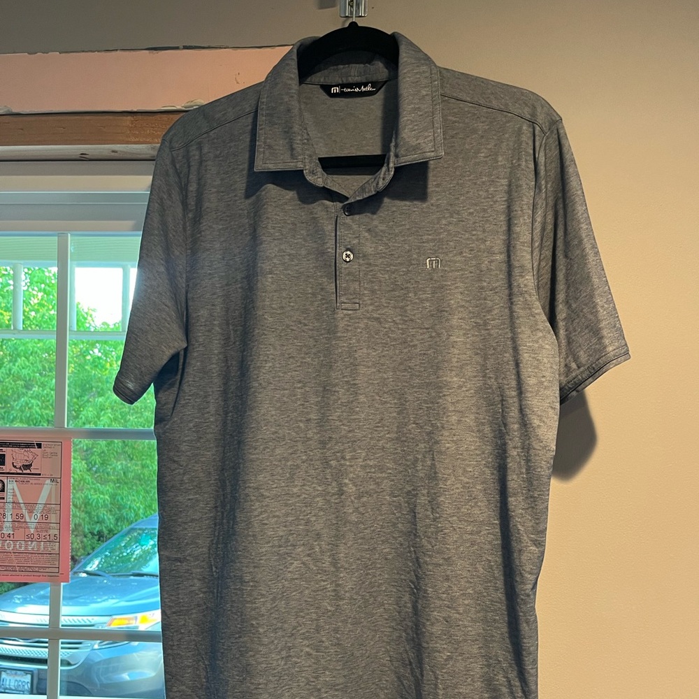 Travis Matthew blue polo, size large.